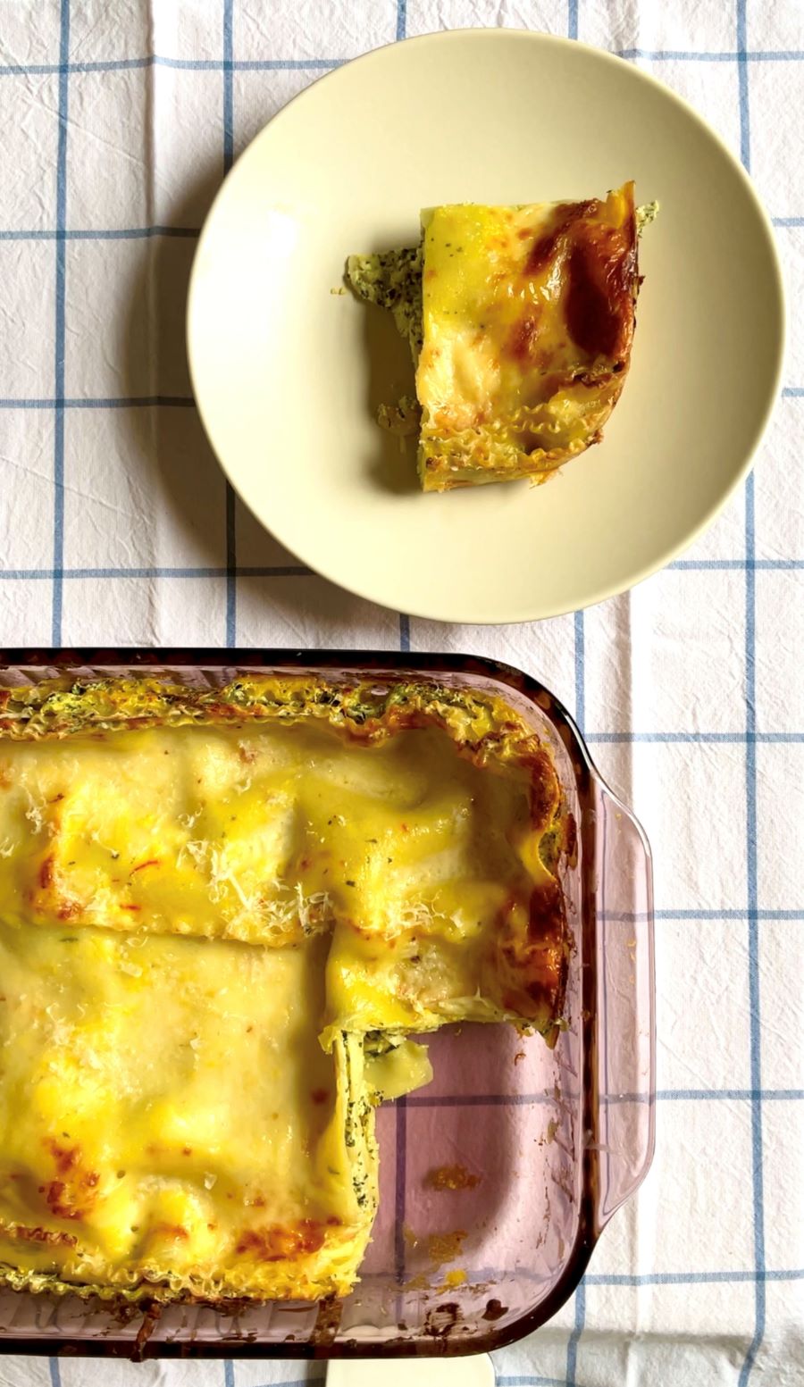 Saffron lasagna made from saffron bechamel, spinach ricotta filling, and topped with mozzarella and Parmesan recipe. Great for group dinner & make ahead meal